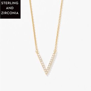 Touchstone crystal. Tiny V necklace, golden. New in box.